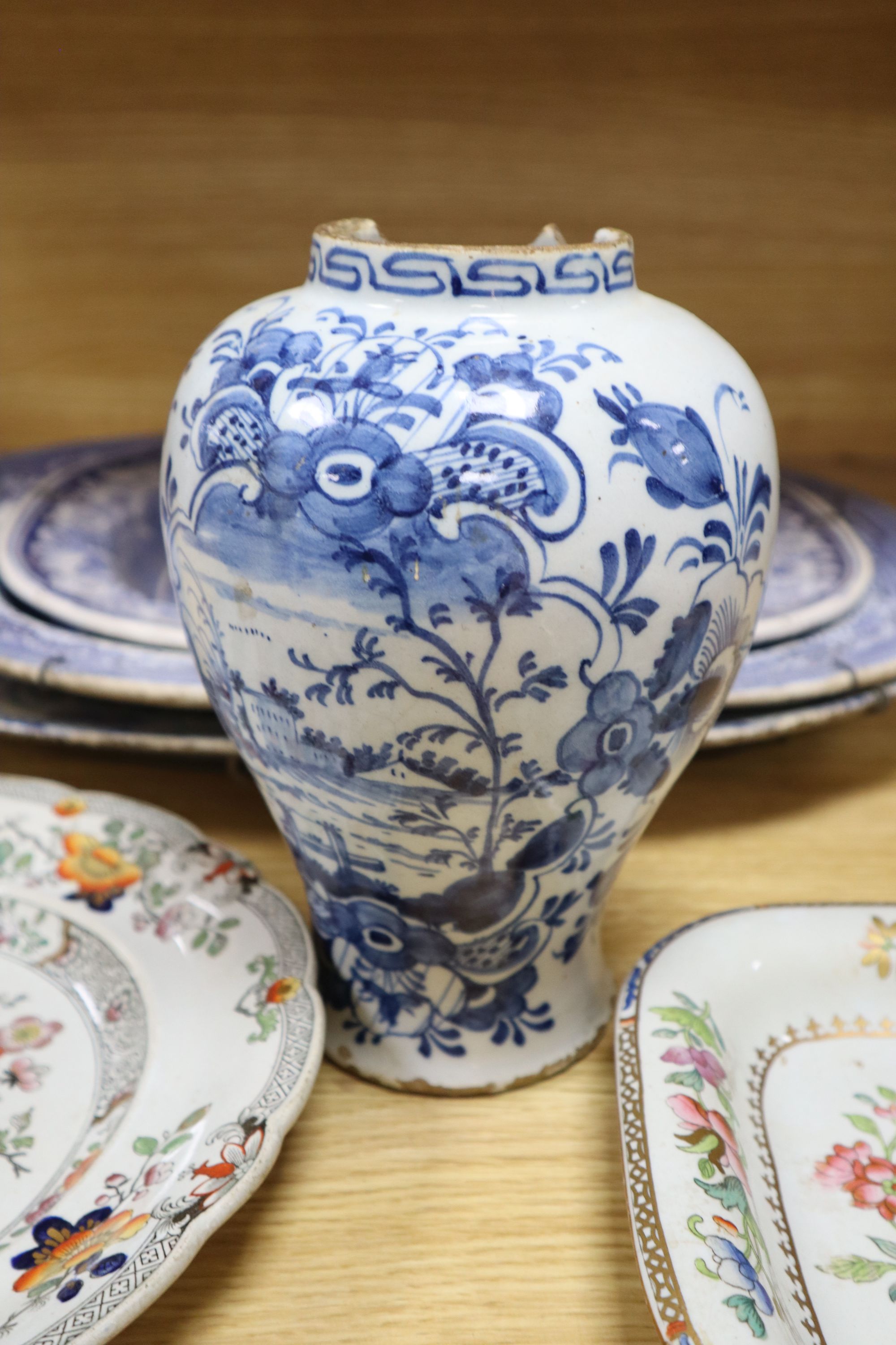 Three blue and white meat platters, largest 49cm wide, two ironstone plates and a tureen and a Delft vase